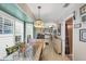 Bright breakfast nook with window seat and table, offering a view of the kitchen at 7168 Lighthouse St, Englewood, FL 34224