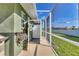 Outdoor shower with privacy enclosure next to house at 7168 Lighthouse St, Englewood, FL 34224