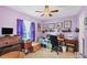 Home office with a wooden desk and purple walls at 7168 Lighthouse St, Englewood, FL 34224