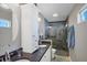 Bathroom with granite countertop, double sinks, and a large shower at 7168 Lighthouse St, Englewood, FL 34224