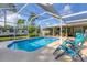 Sparkling screened pool, perfect for relaxation and entertaining at 7168 Lighthouse St, Englewood, FL 34224