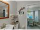 Small bathroom with a toilet and sink near breakfast nook at 7168 Lighthouse St, Englewood, FL 34224