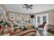 Main bedroom with a queen bed, ceiling fan, and backyard access at 7168 Lighthouse St, Englewood, FL 34224
