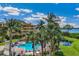 Resort-style pool with lush landscaping at 14021 Bellagio Way # 311, Osprey, FL 34229