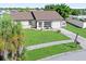 House with a screened porch, and a large backyard at 6367 Facet Ln, Port Charlotte, FL 33981