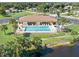 Relaxing community pool with surrounding patio at 6367 Facet Ln, Port Charlotte, FL 33981