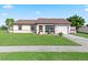 Ranch-style home with a screened porch at 6367 Facet Ln, Port Charlotte, FL 33981