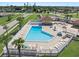 Inviting community pool with lounge chairs and patio area at 6367 Facet Ln, Port Charlotte, FL 33981