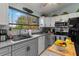 Well-equipped kitchen featuring stainless steel appliances and gray cabinetry at 6367 Facet Ln, Port Charlotte, FL 33981