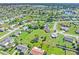 Aerial view of residential neighborhood, showcasing homes and landscape at 6367 Facet Ln, Port Charlotte, FL 33981