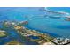 Stunning aerial view of coastal property, showcasing water views, lush landscape, and waterfront homes at 13342 Commonwealth Ave, Port Charlotte, FL 33981