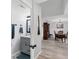 Bathroom features a vanity with modern fixtures, a mirror, decorative elements, and entry to the Dining Room at 13401 Galveston Ave, Port Charlotte, FL 33981