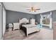 Charming bedroom with wood-look floors, a ceiling fan, a window and tasteful furnishings at 13401 Galveston Ave, Port Charlotte, FL 33981
