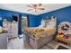 Stylish bedroom with modern farmhouse accents and wood-look floors at 13401 Galveston Ave, Port Charlotte, FL 33981
