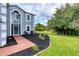 Home featuring a landscaped garden and front door with seating at 13401 Galveston Ave, Port Charlotte, FL 33981