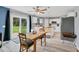 Bright eat-in kitchen with white cabinets and stainless appliances, and sliding glass doors at 13401 Galveston Ave, Port Charlotte, FL 33981