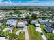 A waterfront property on a canal features a circular driveway and a well-maintained lawn at 1715 Riverside Dr, Englewood, FL 34223