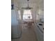 Kitchen with white appliances and dining area at 19365 Water Oak Dr # 203, Port Charlotte, FL 33948