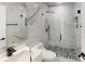 Modern bathroom with marble tile and a glass shower enclosure at 324 Comstock St, Port Charlotte, FL 33954