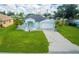 Single-story home with a large green lawn and a two-car garage at 324 Comstock St, Port Charlotte, FL 33954
