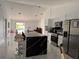 Modern kitchen with stainless steel appliances and marble flooring at 324 Comstock St, Port Charlotte, FL 33954