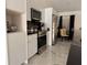 Modern kitchen with white cabinets and stainless steel appliances at 324 Comstock St, Port Charlotte, FL 33954