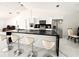 Modern kitchen with large island and white cabinets at 324 Comstock St, Port Charlotte, FL 33954