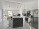Modern kitchen featuring a large island and stainless steel appliances at 324 Comstock St, Port Charlotte, FL 33954