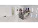 Modern kitchen with large island and white cabinets at 324 Comstock St, Port Charlotte, FL 33954