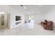 Bright living room with fireplace, pool view, and marble floors at 324 Comstock St, Port Charlotte, FL 33954