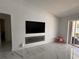 Living room with fireplace and large TV at 324 Comstock St, Port Charlotte, FL 33954