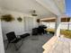 Covered patio with seating and a built-in grill at 324 Comstock St, Port Charlotte, FL 33954