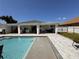 Large pool and patio area with outdoor kitchen at 324 Comstock St, Port Charlotte, FL 33954
