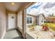 Covered entryway with white gravel landscaping offering curb appeal to the house at 6344 Hera St, Englewood, FL 34224