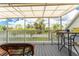 Relaxing screened porch with outdoor seating and tranquil views at 6800 Placida Rd # Th2, Englewood, FL 34224