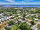 Aerial view showcasing the community near the water with lush landscaping and multiple residential homes at 797 Michigan Ave, Englewood, FL 34223