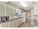 Charming kitchen featuring granite countertops and a full suite of appliances at 797 Michigan Ave, Englewood, FL 34223