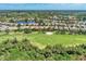 Community overview featuring numerous homes and golf course at 3359 Osprey Ln, Port Charlotte, FL 33953