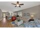 Open concept living room with hardwood floors and access to kitchen at 3359 Osprey Ln, Port Charlotte, FL 33953