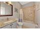 Bathroom boasts granite countertop and tiled shower/tub at 3359 Osprey Ln, Port Charlotte, FL 33953
