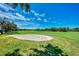 Picturesque golf course sand trap and lush green fairway at 3359 Osprey Ln, Port Charlotte, FL 33953