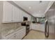 Modern kitchen with stainless steel appliances and granite countertops at 3359 Osprey Ln, Port Charlotte, FL 33953