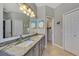 Double vanity bathroom with granite countertops and ample storage at 3359 Osprey Ln, Port Charlotte, FL 33953