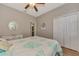 Relaxing bedroom with coral bedding and ceiling fan at 3359 Osprey Ln, Port Charlotte, FL 33953