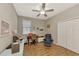 Bright home office features built-in shelving and hardwood floors at 3359 Osprey Ln, Port Charlotte, FL 33953