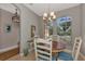 Charming breakfast nook with wood table and blue patterned chairs at 3359 Osprey Ln, Port Charlotte, FL 33953