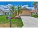 Attractive single-story home with landscaped yard and two-car garage at 3359 Osprey Ln, Port Charlotte, FL 33953