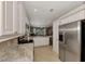 Open kitchen with stainless steel appliances and granite countertops at 3359 Osprey Ln, Port Charlotte, FL 33953