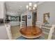 Kitchen features stainless steel appliances and white cabinets, open to breakfast nook at 3359 Osprey Ln, Port Charlotte, FL 33953