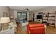 Bright living room with hardwood floors, comfy seating and a large TV at 3359 Osprey Ln, Port Charlotte, FL 33953